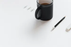 Minimalist Desk Setupwith Coffee Wallpaper