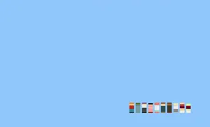 Minimalist Macbook Setup Blue Background Wallpaper