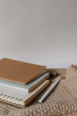 Minimalist Notebooksand Pen Wallpaper