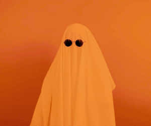 Minimalist Orange Ghost Costume Wallpaper