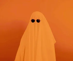 Minimalist Orange Ghost Costume Wallpaper