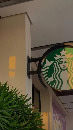 Minimalist Tree On Vibrant Green Field Wallpaper