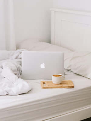 Minimalist Workfrom Bed Setup Wallpaper