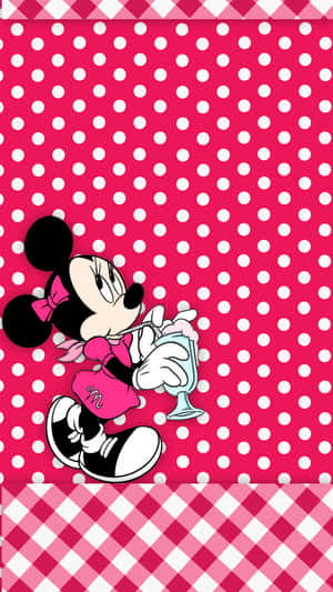 Minnie Mouse In Her Signature Pink Outfit Wallpaper