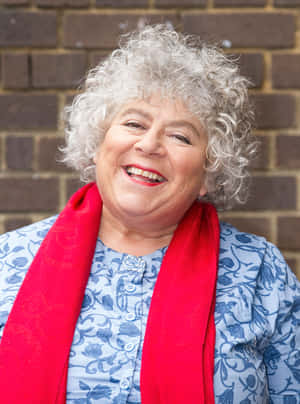 Miriam Margolyes Engaging In A Deep Conversation Wallpaper