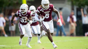 Mississippi State Football Playersin Action Wallpaper