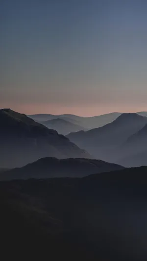 Misty Mountain Layersat Dusk Wallpaper