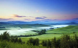 Misty Sunrise Over Hills.jpg Wallpaper