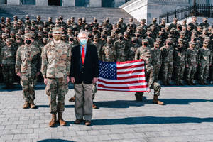 Mitch Mcconnell And Soldiers At Attention Wallpaper