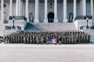 Mitch Mcconnell Standing With Soldiers Wallpaper