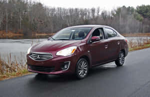 Mitsubishi Mirage Burgundy Side View Wallpaper