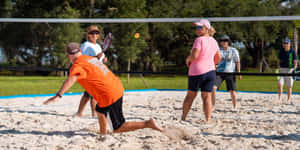 Mixed Doubles Beach Tennis Match Wallpaper