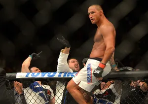 Mixed Martial Artist Dan Henderson Climbing Th Ring Wallpaper