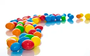 Mms Trail Of Colourful Chocolates Wallpaper