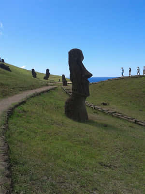 Moai Figures With Tourists Wallpaper
