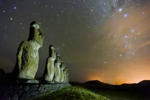 Moai Statues Across Shiny Stars Wallpaper