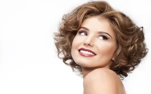 Model's Face With Curly Hair Wallpaper