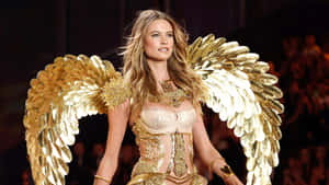 Model_with_ Golden_ Wings_on_ Runway Wallpaper