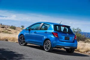 Modern Compact Car Parked On The Street Wallpaper