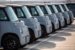 Modern Electric Vehicle On City Street Wallpaper