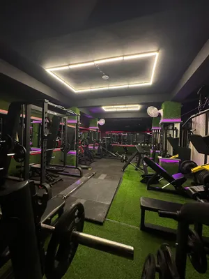 Modern Gym Interiorwith Neon Lights Wallpaper