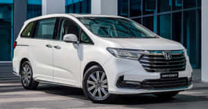 Modern Honda Odyssey Minivan On The Road Wallpaper