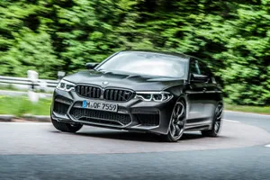 Modern Hybrid Car On A Scenic Road Wallpaper