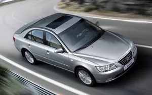 Modern Hyundai Sonata On A Stunning Scenic Road Wallpaper