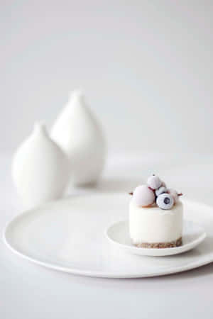 Modern Minimalist Food Plating On A White Background Wallpaper