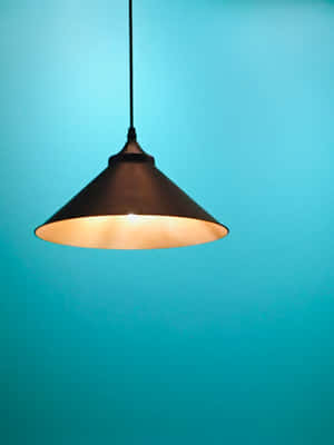 Modern Pendant Light Against Blue Background Wallpaper