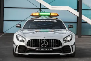 Modern Safety Car In Action On A Racetrack Wallpaper