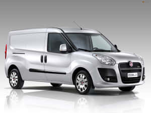 Modern Silver Fiat Doblo On The Open Road Wallpaper