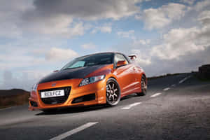 Modern Sleek Honda Cr-z Hybrid On The Road Wallpaper