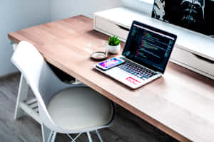 Modern Workstationwith Codeon Laptop Screen Wallpaper