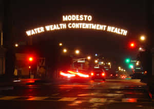 Modesto Arch Nighttime Street Scene Wallpaper