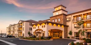 Modesto Elegant Hotel Exterior Dusk Wallpaper