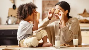 Mom And Myopic Kid Bonding Wallpaper