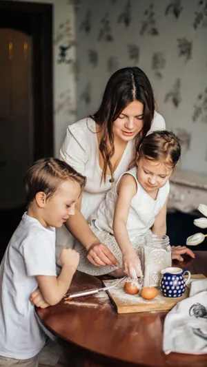Mom Baking With Daughter Wallpaper