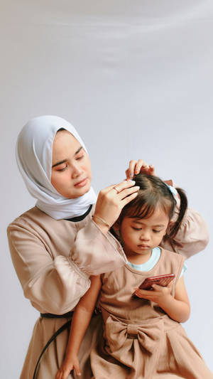 Mom Tying Hair Wallpaper