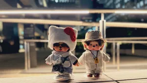 Monchhichi Dolls In Stylish Outfits Wallpaper
