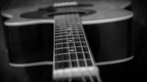 Monochrome Elegance Of An Electric Guitar Wallpaper