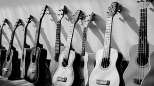 Monochrome Magic: A Timeless Black And White Guitar Wallpaper