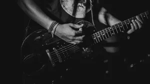 Monochrome Magic: The Beauty Of Black And White Guitars Wallpaper