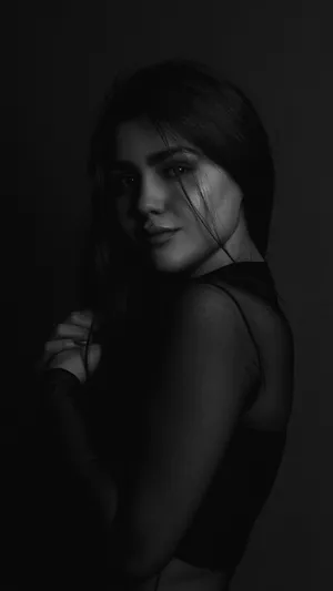 Monochrome Portraitof Womanin Shadow Wallpaper