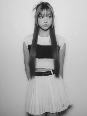 Monochrome Portraitof Young Womanin Stylish Outfit Wallpaper