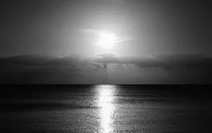 Monochrome_ Sunrise_ Over_ Calm_ Sea Wallpaper