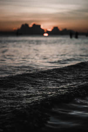 Moody Sunset Beach Waves Wallpaper