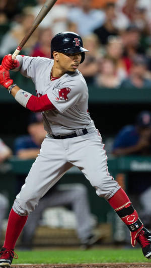 Mookie Betts Swinging A Baseball Bat Wallpaper