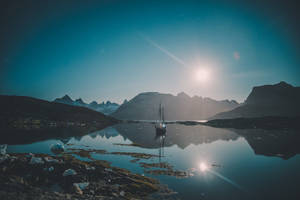 Moon Lit Sailboat In Greenland Wallpaper