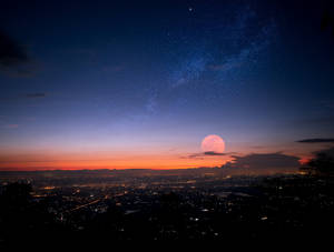 Moon Over Cityscape Hotmail Wallpaper